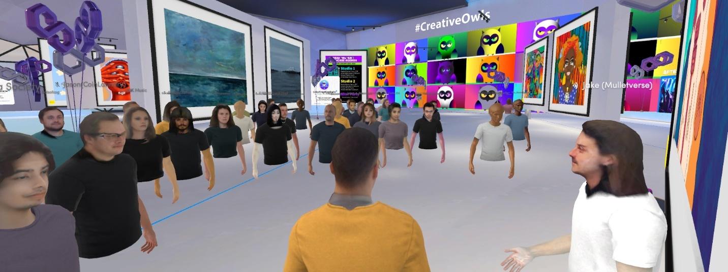 A group of people in a roomDescription automatically generated